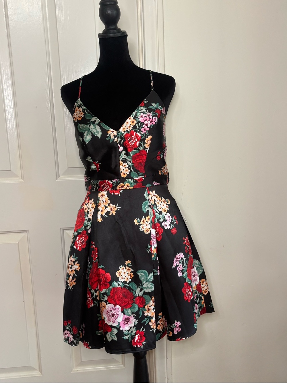 B. Smart Black Mini Dress with Red Floral Print